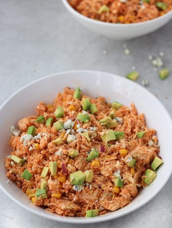 Buffalo Chicken salad in a bowl with avocado and blue cheese