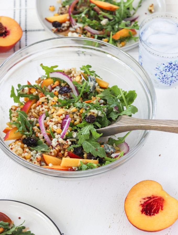 This antioxidant summer salad is filled with sweet peaches, tangy blue cheese, tart dried cherries and nutty walnuts combined with the bite of the red onion makes this salad a joy to eat. Serve this up at your next dinner party | Mealswithmaggie.com #peaches #peachsalad #summerpeachsalad #antioxidants #healthysummerdish #peachrecipes #driedcherries