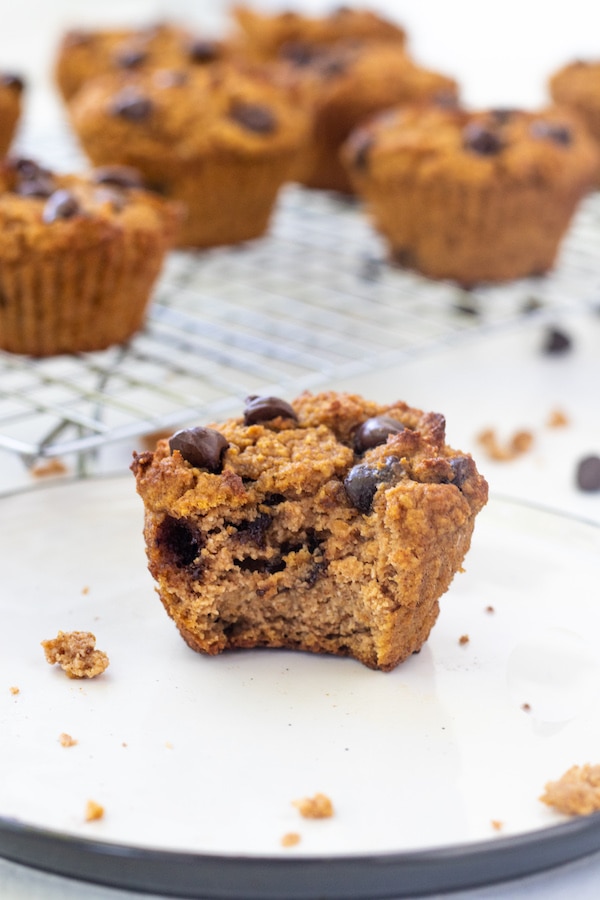 Close up picture of pumpkin muffin with a bite taken out of it.