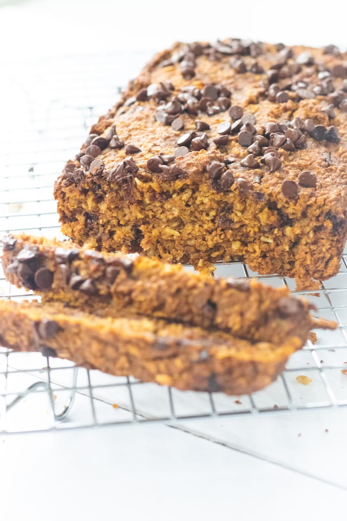 This simple chocolate chip pumpkin oat bread is the perfect addition to your morning coffee. It is soft, chewy and full of fiber. The best part? No fancy ingredients needed. | Mealswithmaggie.com #pumpkinbread #glutenfreebread #highfiber #Oatflour #oatbread #pumpkinchocolatechipbread