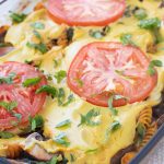 pasta bake in a casserole topped with tomatoes