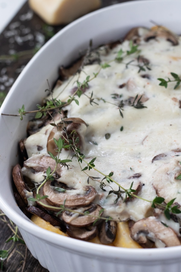 Baked polenta and mushroom casserole – This casserole is a tasty holiday side dish that is gluten free and option to be vegan. The combination of polenta, mushrooms and thyme creates a harmonious blend of flavors that lends a new definition to comfort food. | MealswithMaggie.com #healthythanksgiving #casserole #thanksgivingcasserole #glutenfreecasserole #veganthanksgiving #healthycasserole