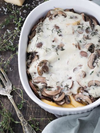 Baked polenta and mushroom casserole – This casserole is a tasty holiday side dish that is vegan and gluten free.  The combination of polenta, mushrooms and thyme creates a harmonious blend of flavors that lends a new definition to comfort food.  | MealswithMaggie.com #healthythanksgiving #casserole #thanksgivingcasserole #glutenfreecasserole #veganthanksgiving #healthycasserole
