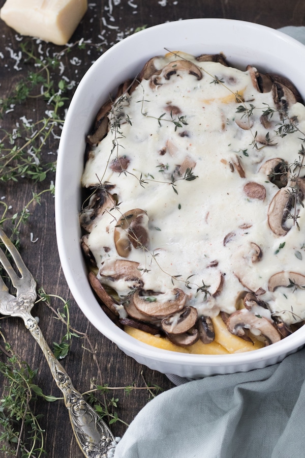 Baked polenta and mushroom casserole – This casserole is a tasty holiday side dish that is gluten free and option to be vegan. The combination of polenta, mushrooms and thyme creates a harmonious blend of flavors that lends a new definition to comfort food. | MealswithMaggie.com #healthythanksgiving #casserole #thanksgivingcasserole #glutenfreecasserole #veganthanksgiving #healthycasserole