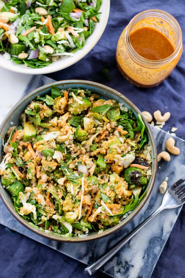 Over top view of salad with chopped salad and peanut sauce.