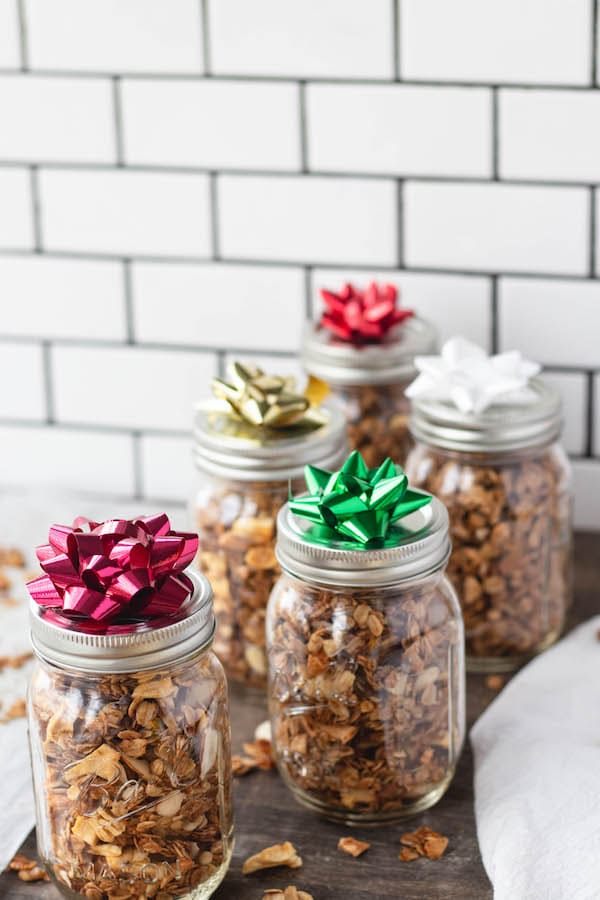 mason jars filled with healthy holiday granola on counter