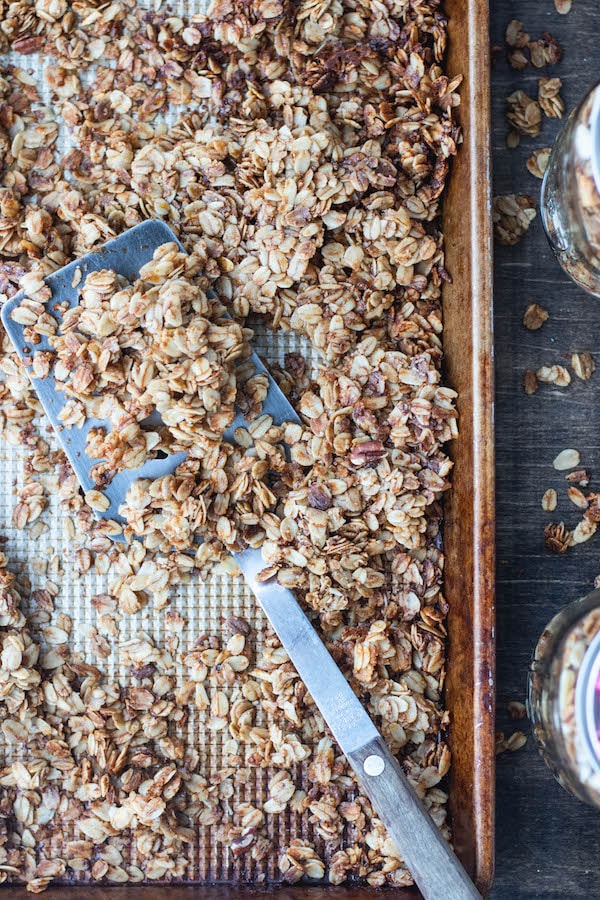 food on baking sheet with spatula