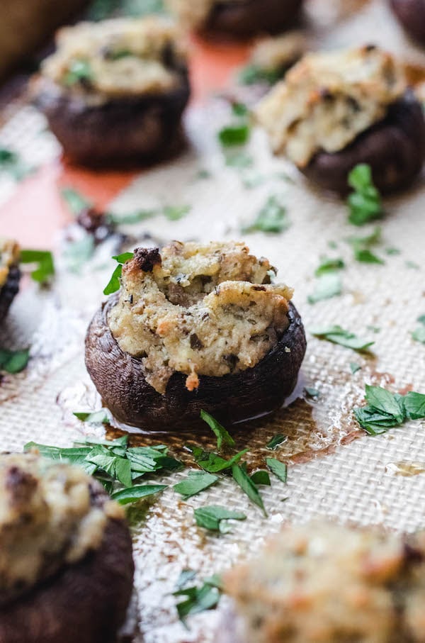 mushrooms on baking sheet stuffed with filling