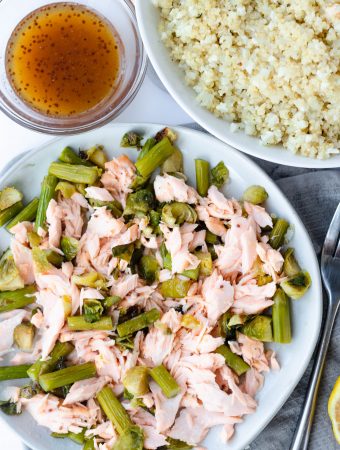 maple salmon on a plate with vegetables.