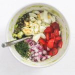 All of the healthy avocado egg salad ingredients in a bowl separately