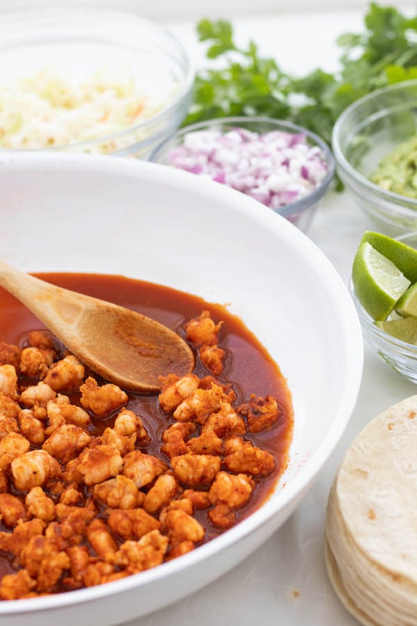 table setting with shrimp tacos