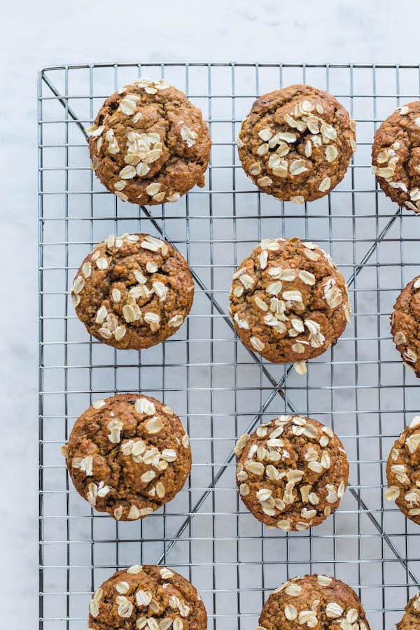 Rows of muffins on a drying rack.