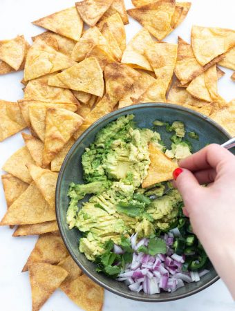 bowl of guacamole with chips