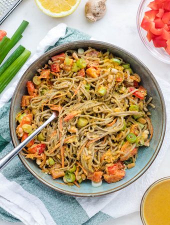 Soba noodle salad with fork sticking out of the bowl.