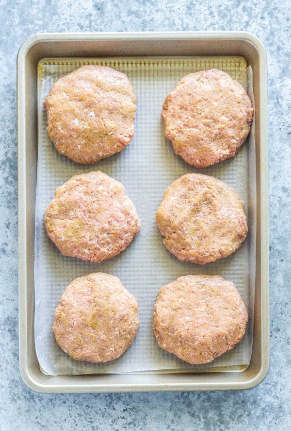 Healthy turkey burgers on a sheet pan.