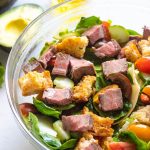 Steak salad in a bowl up close.