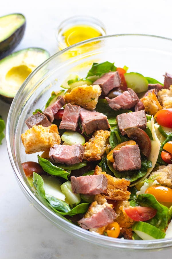 Steak salad in a bowl up close.