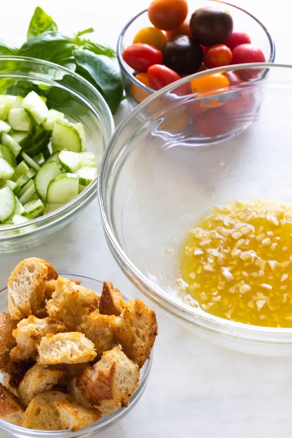 Ingredients for Steak Panzanella salad in bowls