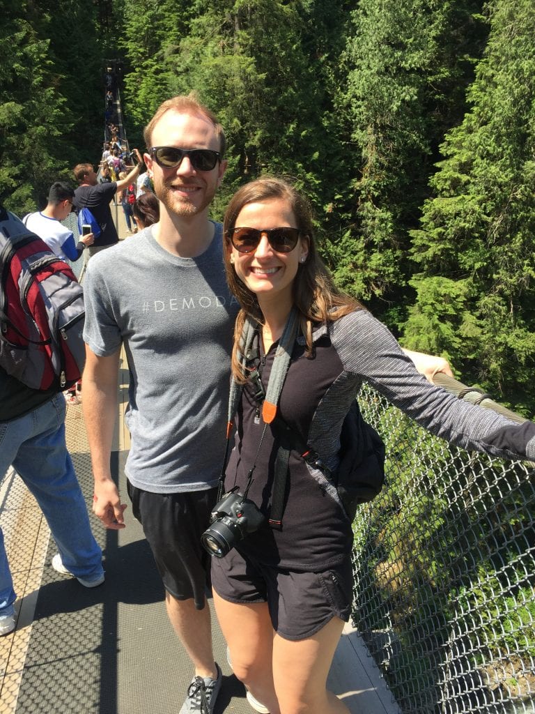 2 people standing on a bridge in Vancouver