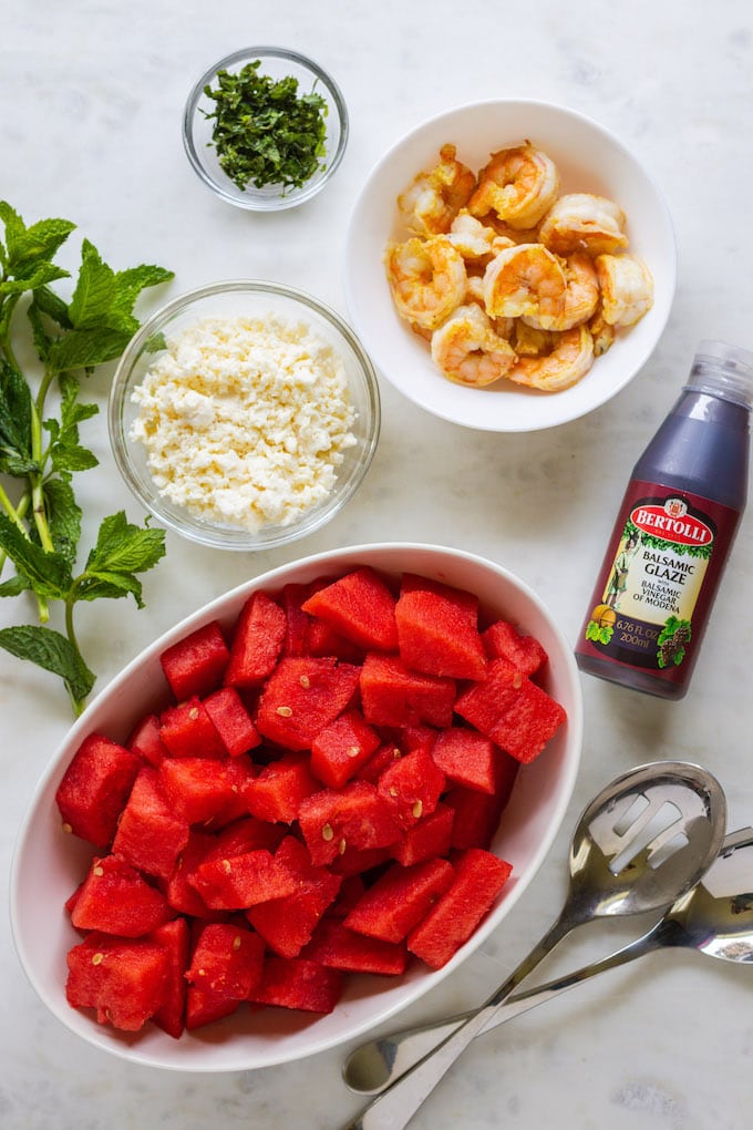 watermelon and other ingredients in separate bowls.