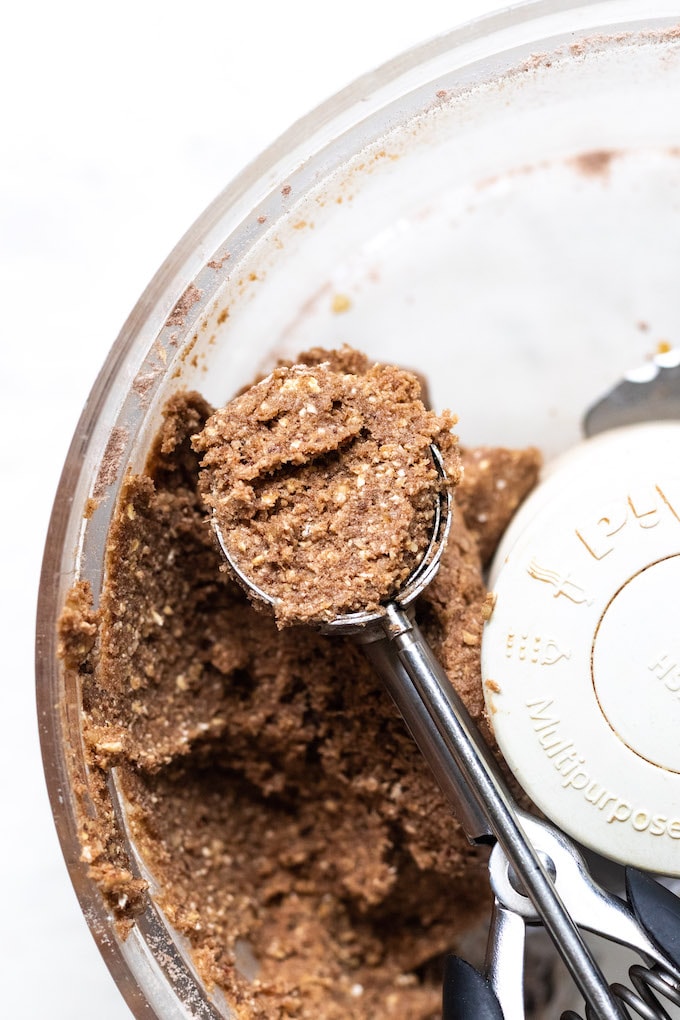 A scoop of protein ball inside a food processor. 