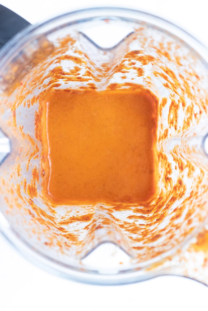 Inside view of a blender with sauce in it.