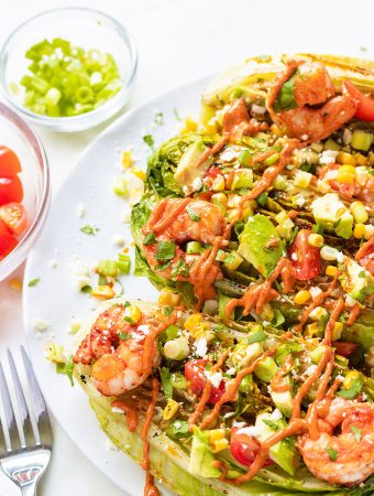 Side view of grilled romaine salad with chipotle shrimp