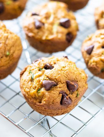 zucchini pumpkin muffins on a cooling rack.