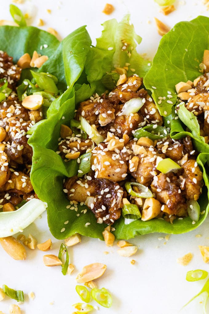 A side view of ginger sesame chicken lettuce wraps