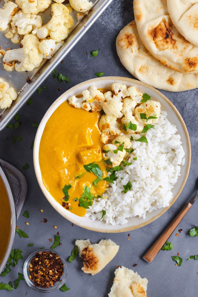 A view of a butternut squash curry with cauliflower and rice. 