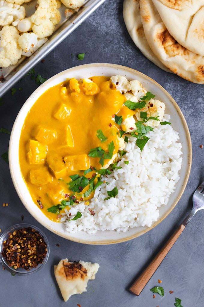 A bowl of butternut squash curry with tofu.