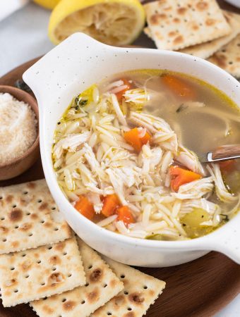 A bowl of soup with a fork in it.