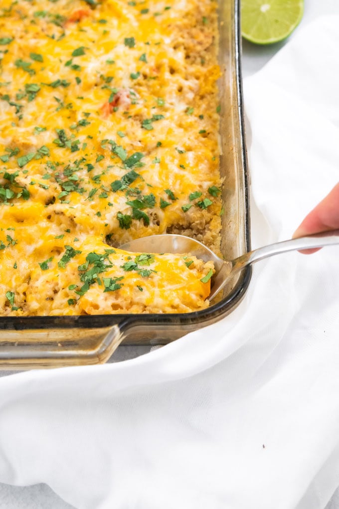 A spoon scooping out some of the casserole.