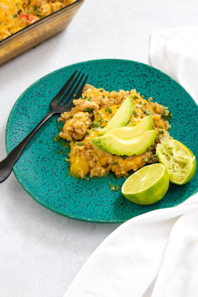 Food on a plate with a fork and avocado. 