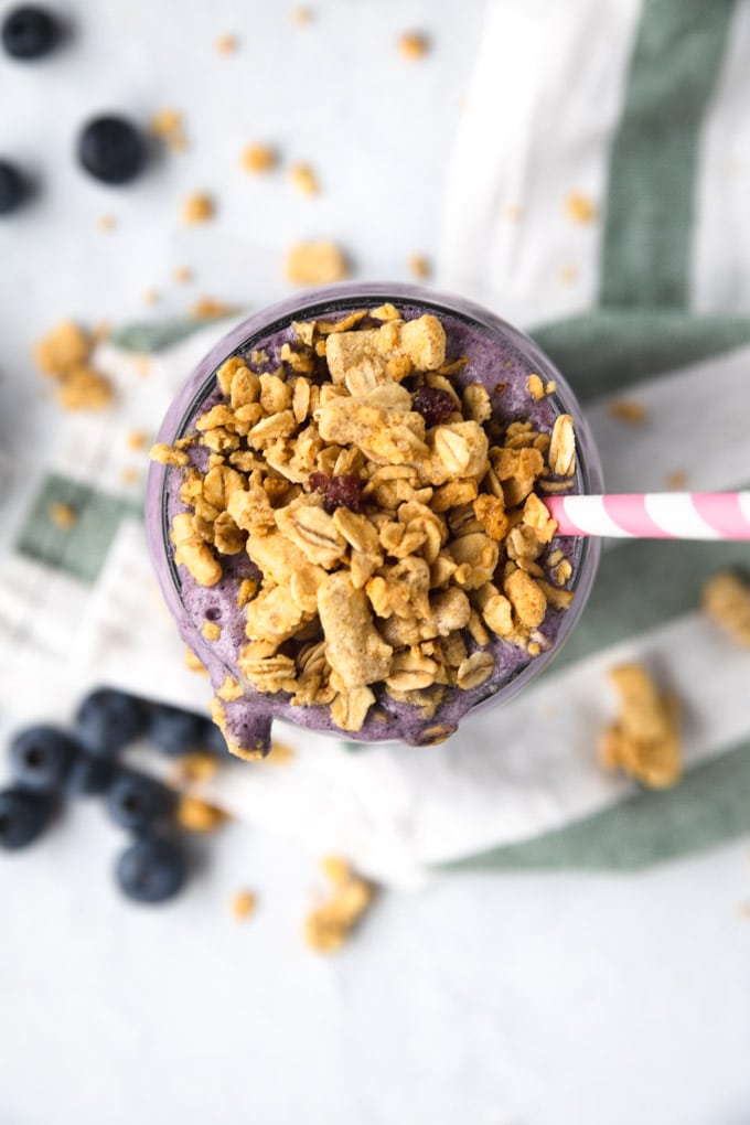 A close up of granola on top of a smoothie