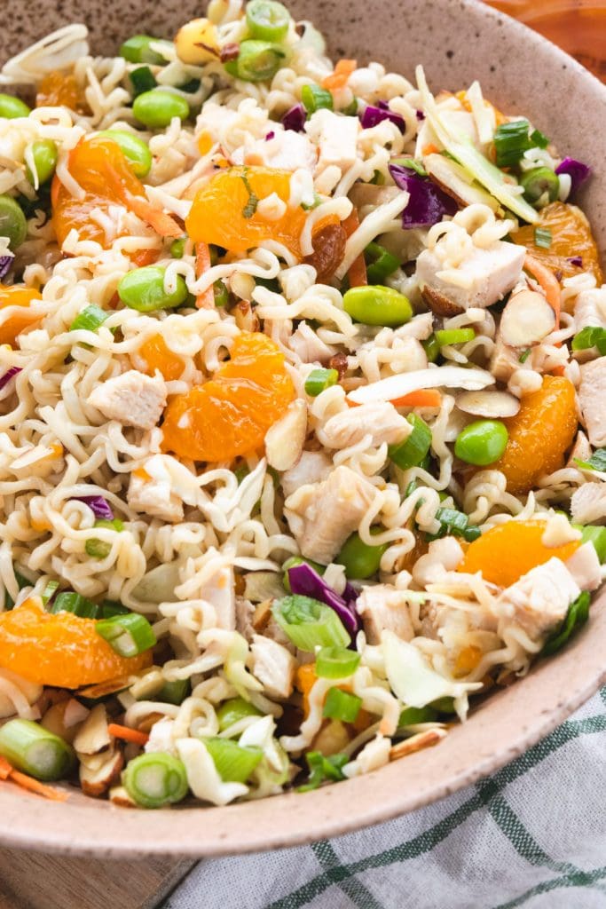 Ingredients for asian chicken salad in a bowl.