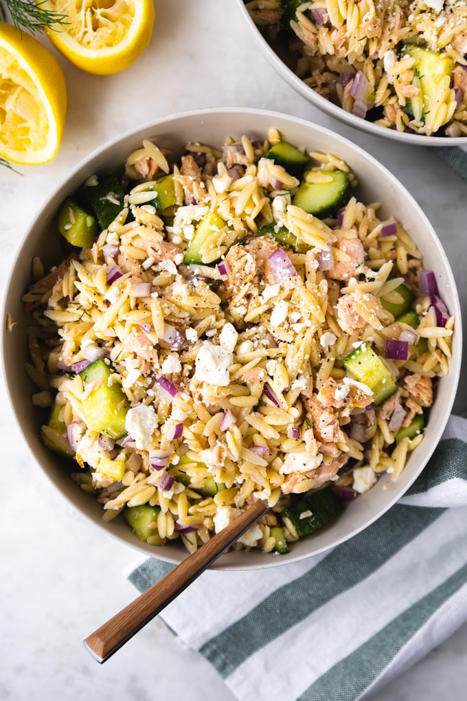 Salmon salad in a bowl with a fork.