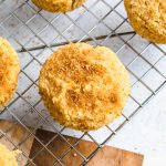 The top of a snickerdoodle muffin with cinnamon sugar on it.