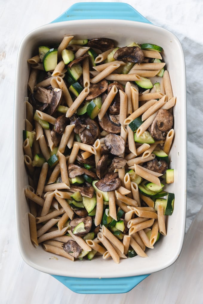 Vegetables and pasta in a casserole dish.