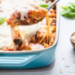 A scoop of chicken pasta bake with cheese