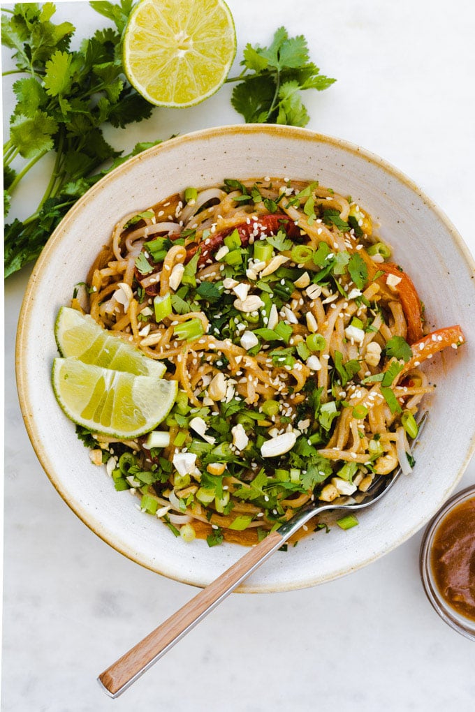 a bowl of pad thai with peanut sauce.