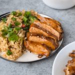 Chicken teriyaki on a plate with rice.