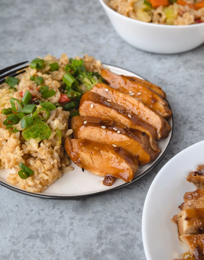 Teriyaki on a place with rice.