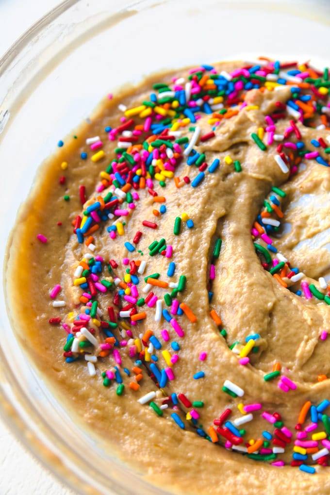 Sprinkles and batter in a bowl. 