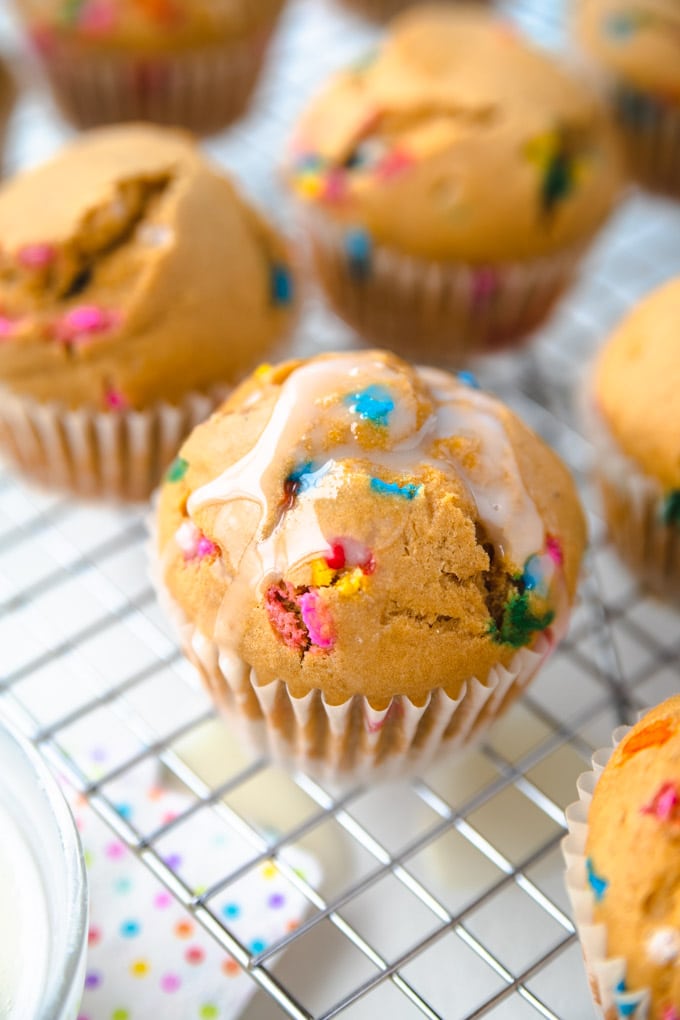 a bunch of healthy funfetti cupcakes on a rack.