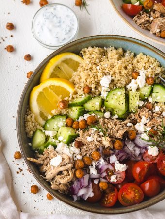 Chicken shawarma in a bowl with toppings.