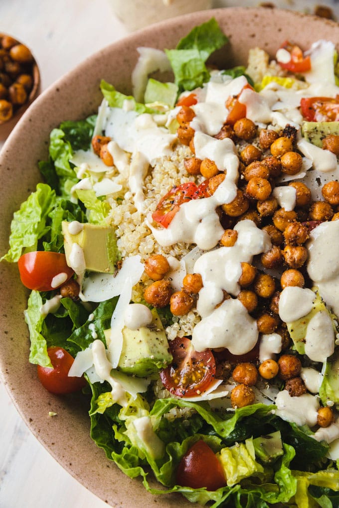 healthy Caesar salad in a bowl with dressing