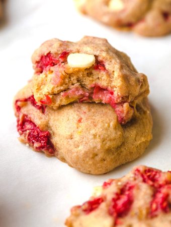 two raspberry cookies on top of each other.