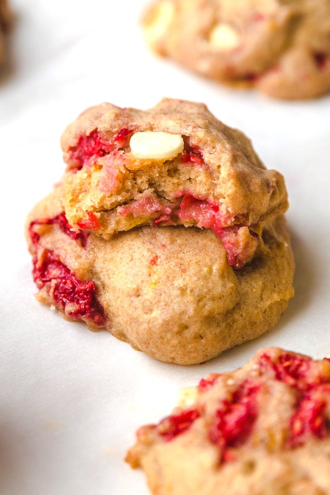 two raspberry cookies on top of each other.