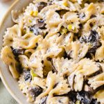 bow tie pasta in a bowl with mushrooms and leeks